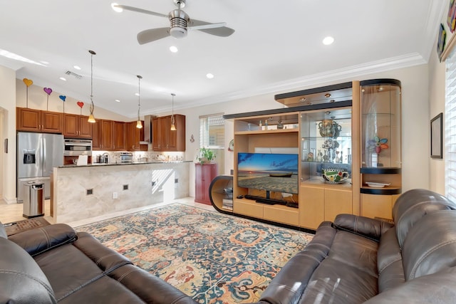 tiled living room featuring ceiling fan, ornamental molding, and vaulted ceiling