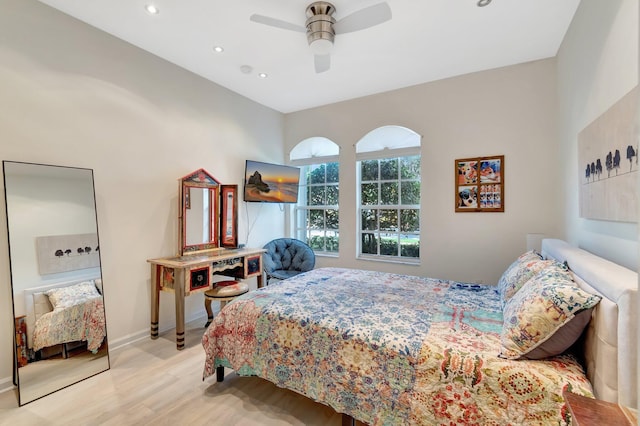 bedroom featuring ceiling fan and light hardwood / wood-style floors