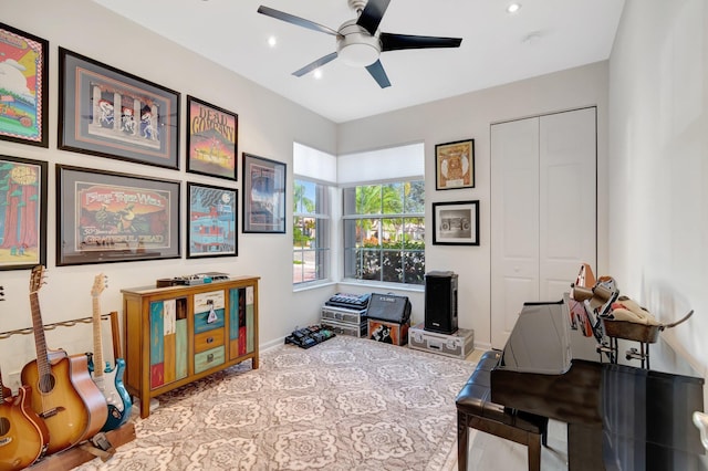 interior space with ceiling fan