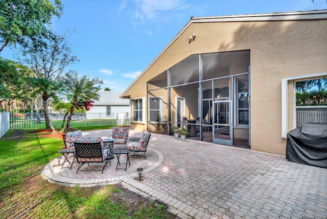 view of patio / terrace with a grill and a sunroom