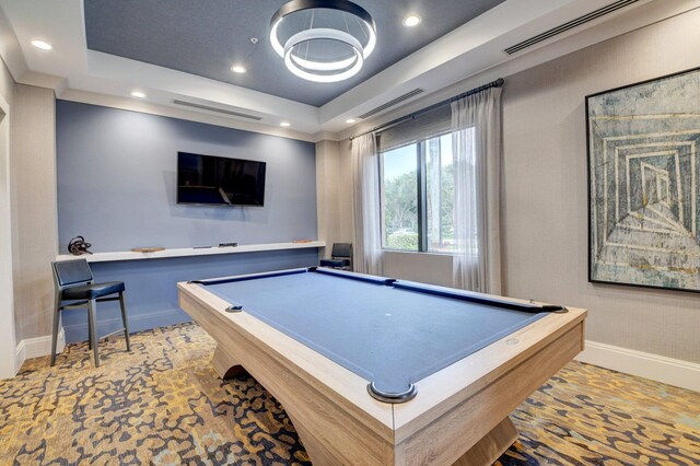 rec room with billiards and a tray ceiling