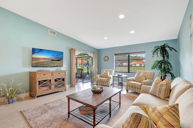 living room with vaulted ceiling