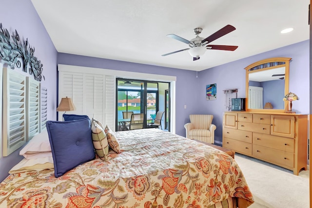 bedroom with light carpet, access to outside, and ceiling fan