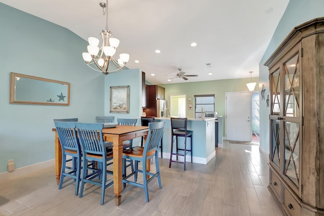 dining area with ceiling fan and light hardwood / wood-style floors