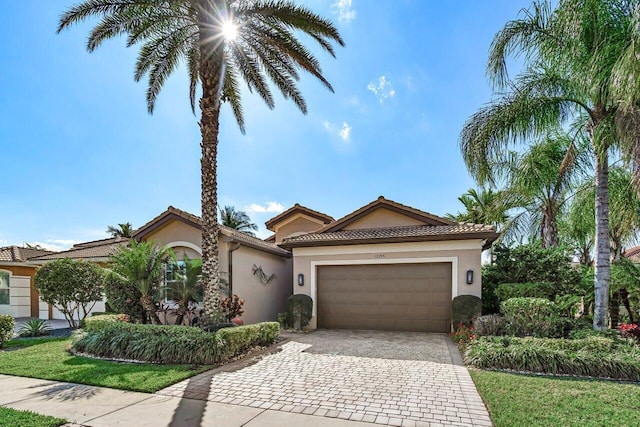 mediterranean / spanish house featuring a garage