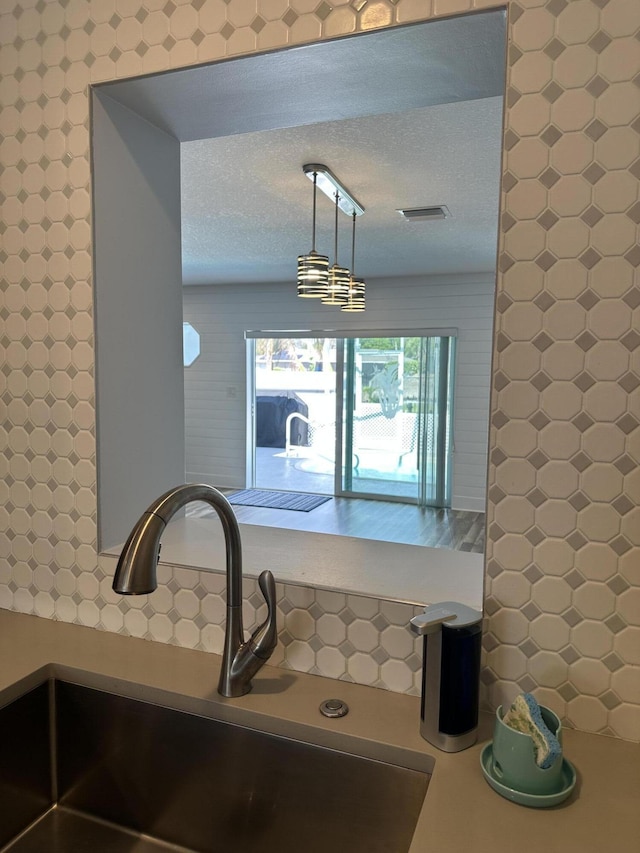 kitchen view of a sink and an office area
