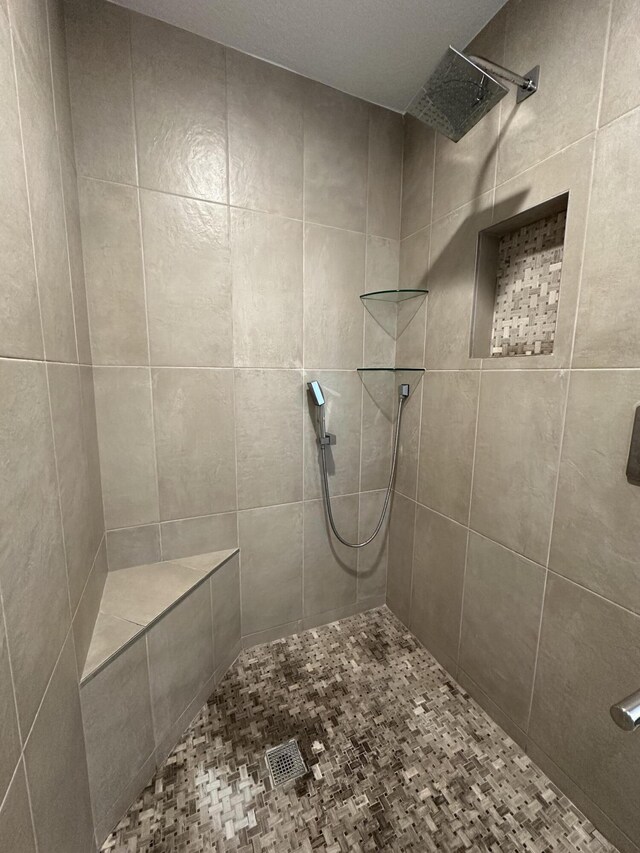 bathroom featuring tile patterned flooring and a shower with door