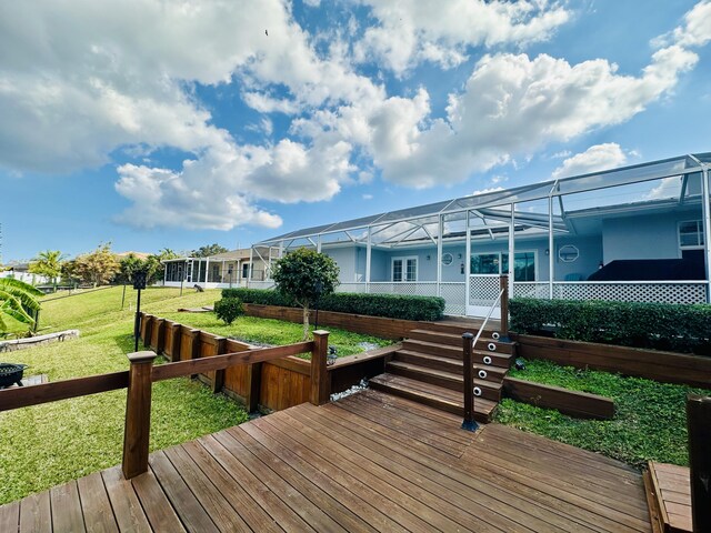 view of yard featuring a storage shed, an outdoor fire pit, and a lanai