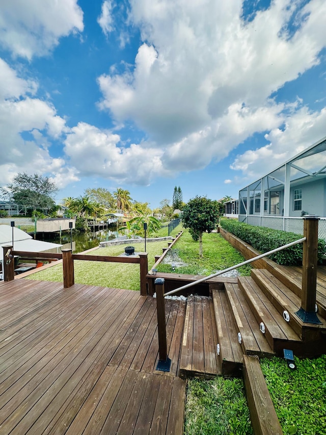 wooden terrace with a yard and a boat dock