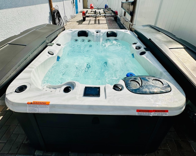 exterior view of central AC unit and a jacuzzi