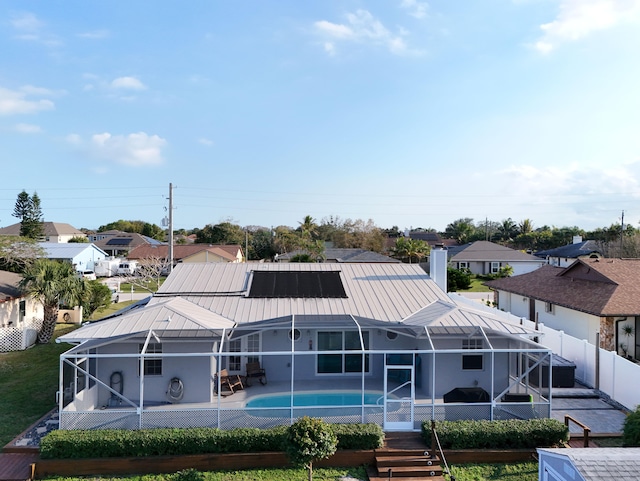 back of house featuring a patio, a lanai, a fenced backyard, and a residential view