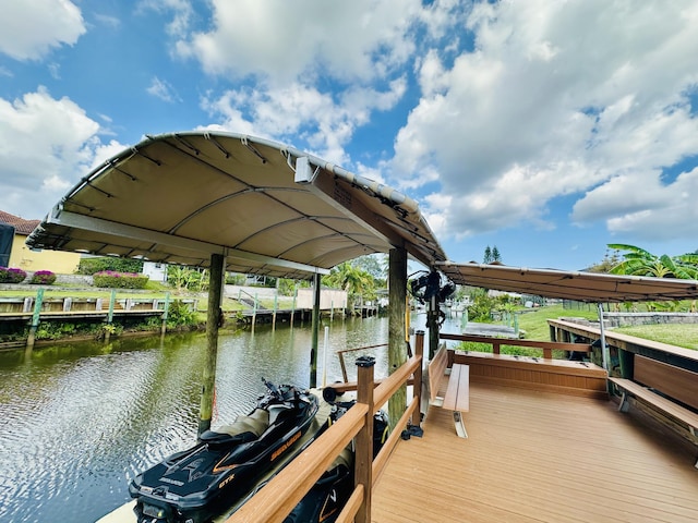 dock area with a water view