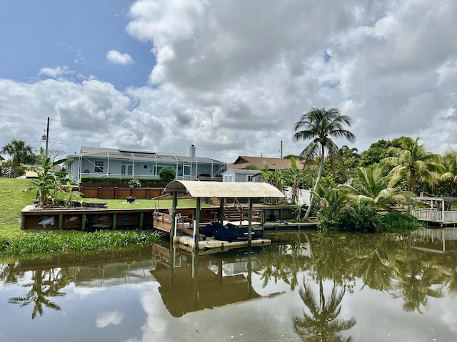 dock area featuring a water view and boat lift