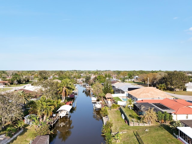 aerial perspective of suburban area featuring a nearby body of water