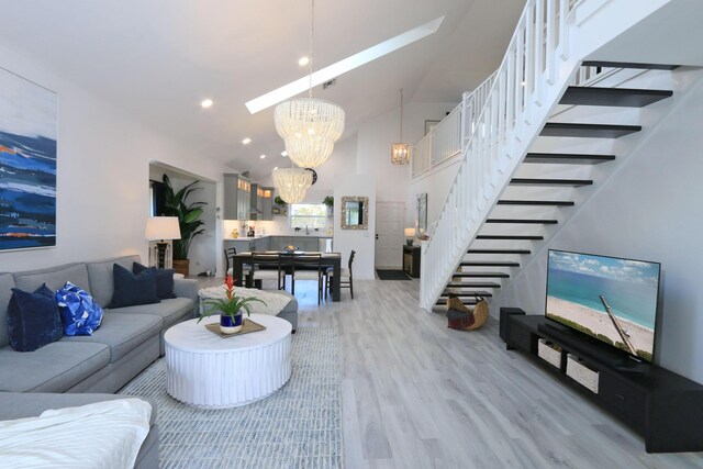 4161 S US Highway 1 Unit E3, Jupiter, FL 33477 - living area with stairway, light wood-type flooring, a chandelier, lofted ceiling, and recessed lighting