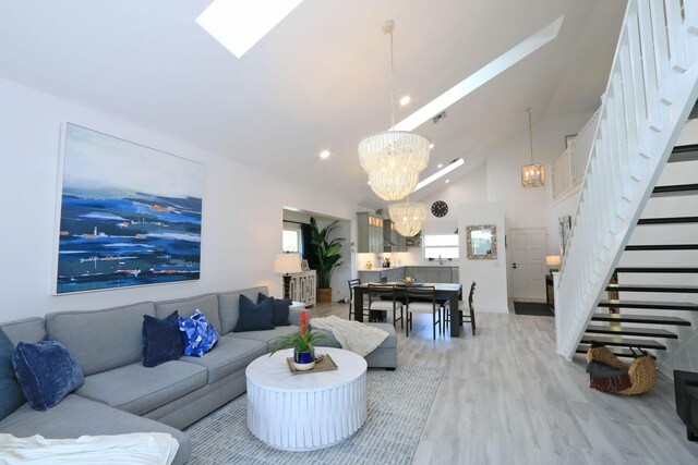 4161 S US Highway 1 Unit E3, Jupiter, FL 33477 - living room featuring a chandelier, stairs, light wood-style flooring, high vaulted ceiling, and recessed lighting