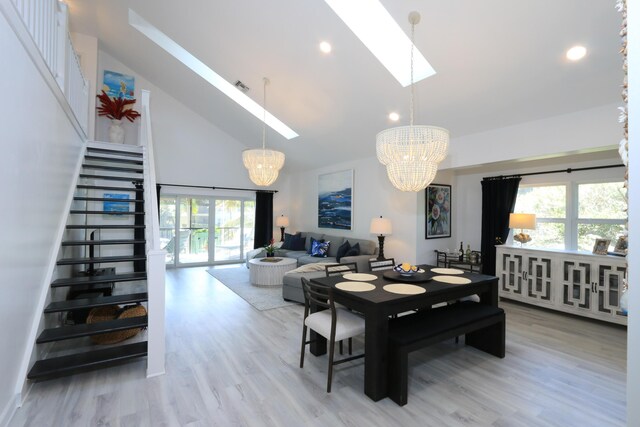 4161 S US Highway 1 Unit E3, Jupiter, FL 33477 - dining area featuring a chandelier, a skylight, plenty of natural light, wood finished floors, and recessed lighting