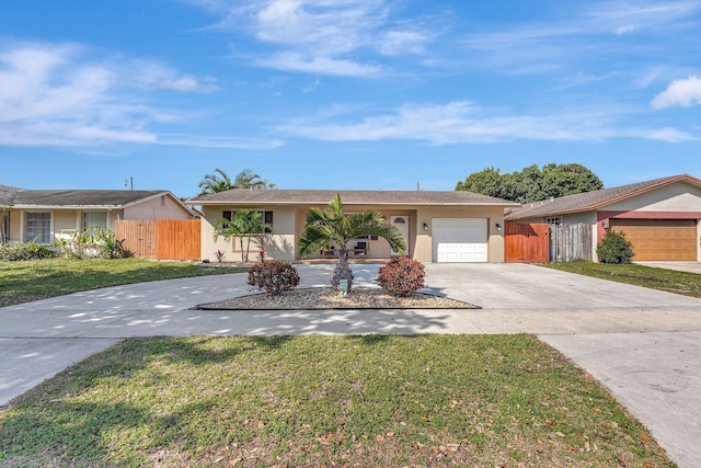 ranch-style home featuring a garage, concrete driveway, fence, and stucco siding