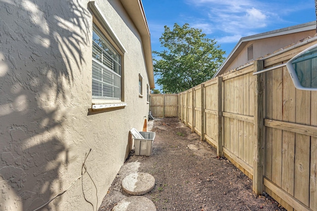 view of home's exterior with a fenced backyard and stucco siding