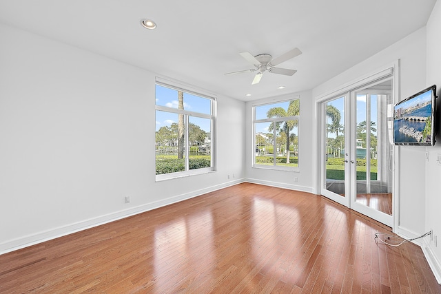 interior space with french doors, ceiling fan, and hardwood / wood-style floors