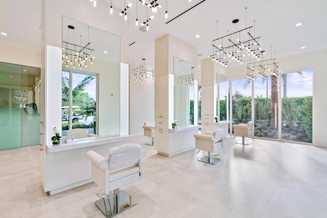 bathroom featuring a notable chandelier and a high ceiling