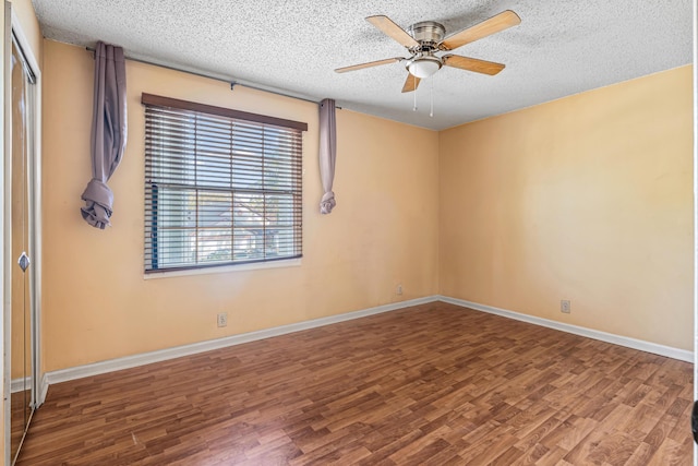 unfurnished room featuring hardwood / wood-style flooring, a textured ceiling, and ceiling fan