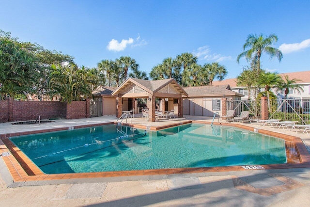 view of swimming pool with a patio and a gazebo