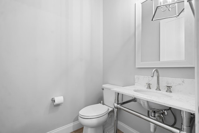 bathroom with sink and toilet