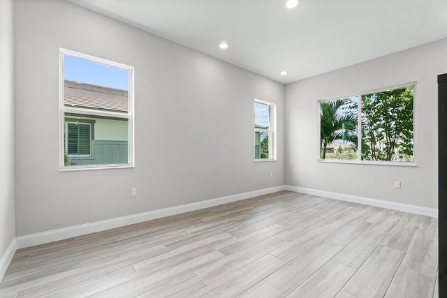 spare room featuring light wood-type flooring