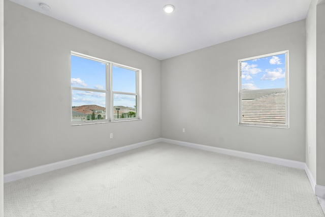 unfurnished room with carpet flooring