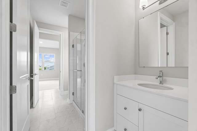 bathroom with vanity and an enclosed shower