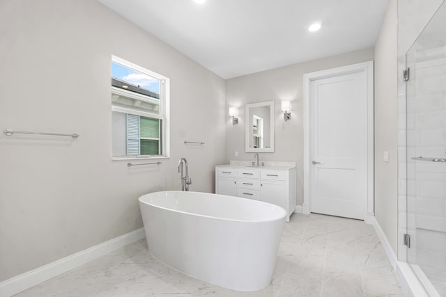 bathroom with vanity and separate shower and tub