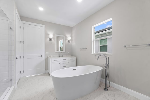 bathroom with vanity, plenty of natural light, and plus walk in shower