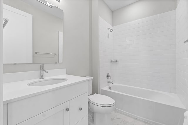 full bathroom with vanity, toilet, and tiled shower / bath