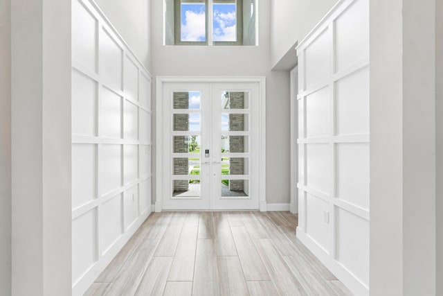 unfurnished sunroom with french doors