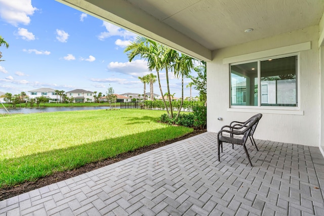 view of patio / terrace with a water view