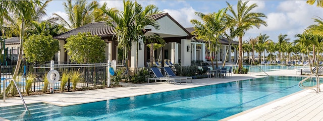 pool featuring a patio and fence