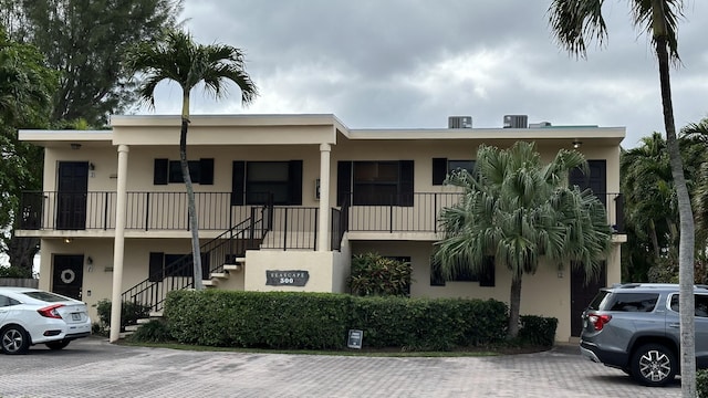 view of property featuring stairs