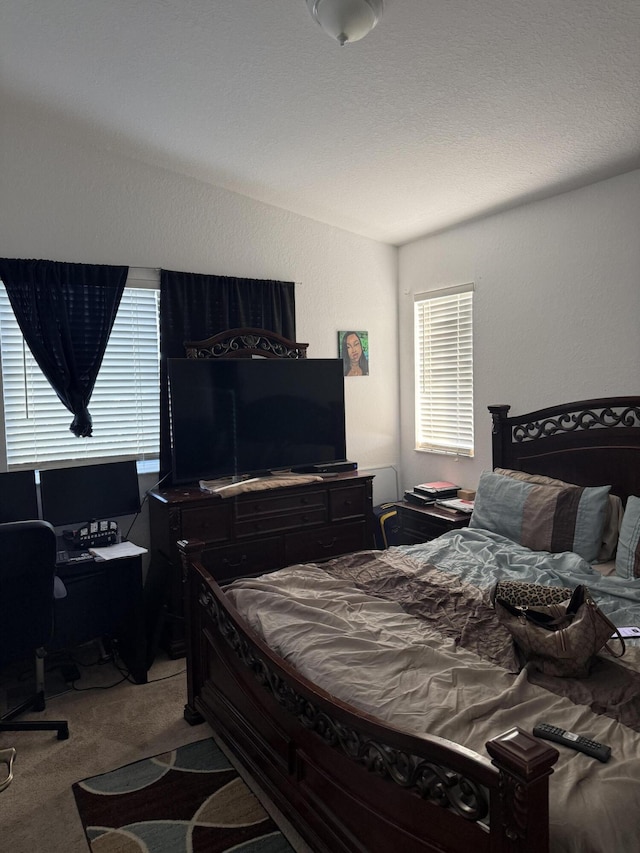 bedroom with vaulted ceiling and carpet flooring