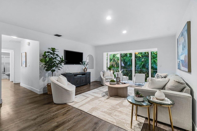 living room with dark hardwood / wood-style flooring