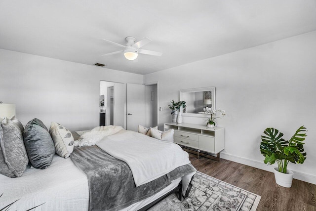 bedroom featuring dark hardwood / wood-style floors and ceiling fan