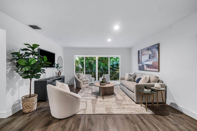 living room featuring dark hardwood / wood-style flooring