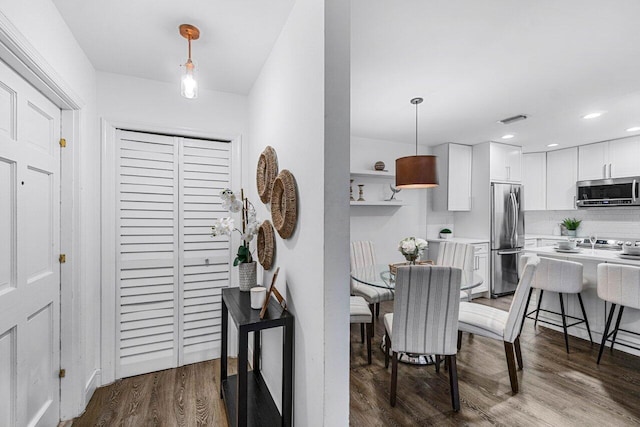 dining area featuring hardwood / wood-style floors