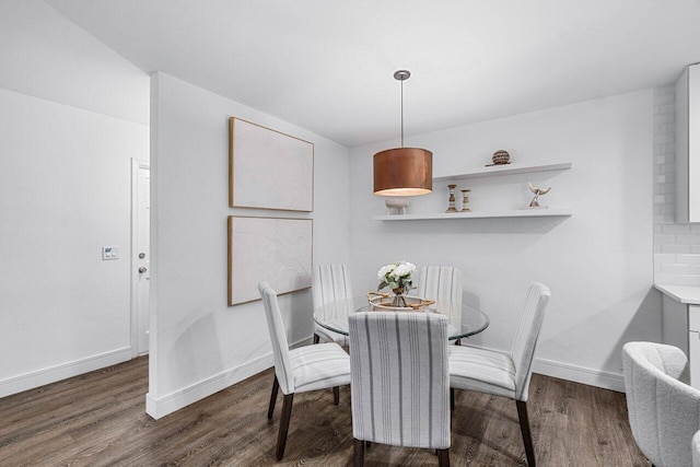 dining area with dark wood-type flooring