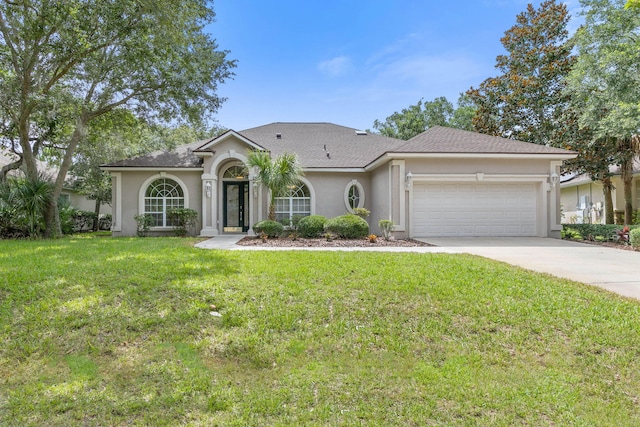 ranch-style house featuring a garage and a front lawn