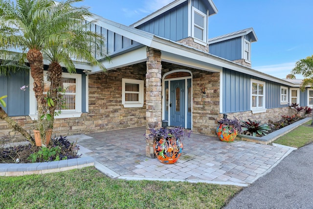 doorway to property with a patio area