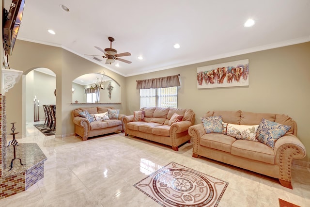 living room with crown molding and ceiling fan