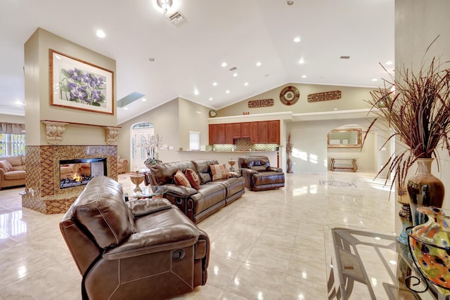 living room with crown molding, high vaulted ceiling, and a multi sided fireplace