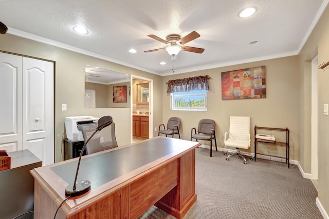 office featuring ornamental molding, light carpet, a textured ceiling, and ceiling fan