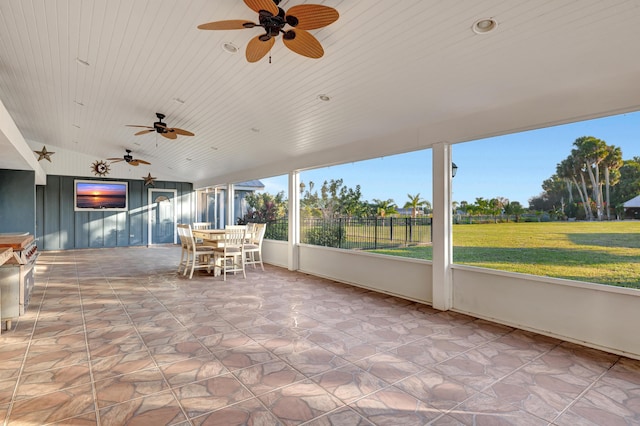 unfurnished sunroom with lofted ceiling and wooden ceiling